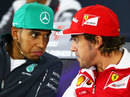 Lewis Hamilton and Fernando Alonso chat and share a joke in the Thursday press conference