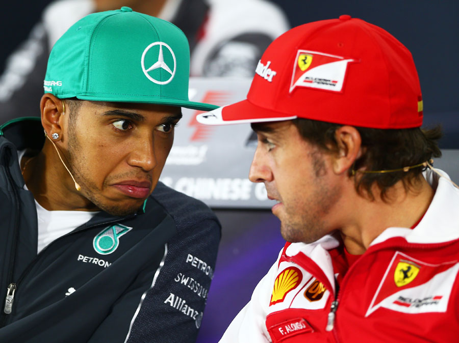 Lewis Hamilton and Fernando Alonso chat and share a joke in the Thursday press conference