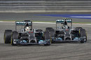 Nico Rosberg and Lewis Hamilton go wheel-to-wheel through Turn 1
