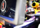 Sebastian Vettel looks across the Red Bull garage