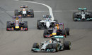 Lewis Hamilton leads into Turn 1 as Felipe Massa attacks Daniel Ricciardo for fourth