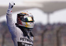 Lewis Hamilton celebrates victory in parc ferme