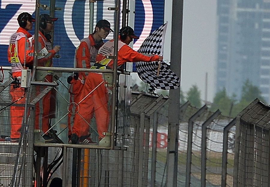 The chequered flag waves at the end of the race