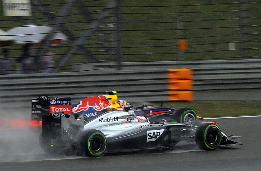 Jenson Button and Daniel Ricciardo go wheel-to-wheel