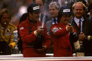 Nigel Mansell celebrate his maiden victory alongside team-mate Alain Prost, whose four points were enough to secure the title