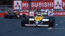 Keke Rosberg leads Ayrton Senna through the streets 