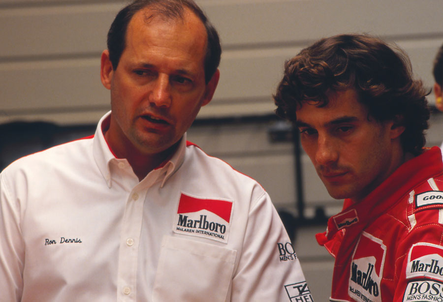 Ron Dennis and Ayrton Senna talk in the paddock, circa 1990
