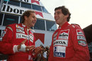 Gerhard Berger shares a joke with team-mate Ayrton Senna