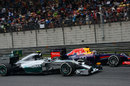 Nico Rosberg passes Sebastian Vettel into the hairpin