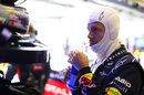 Sebastian Vettel watches on in the garage