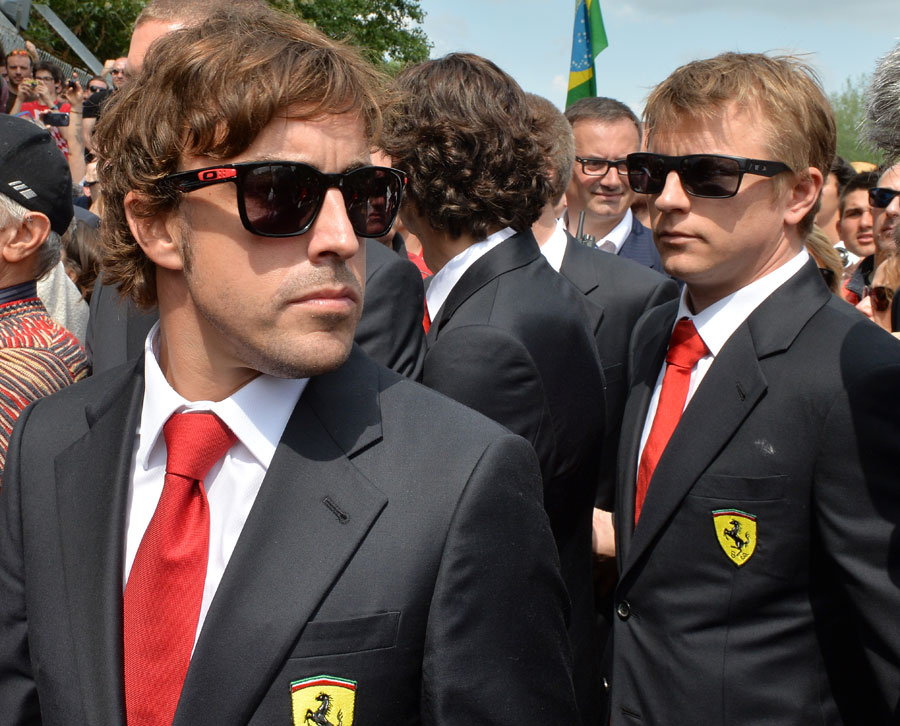 Fernando Alonso and Kimi Raikkonen stand at Tamburello corner for the tribute to Ayrton Senna