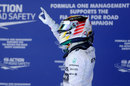 Lewis Hamilton gestures to the crowd after winning pole position