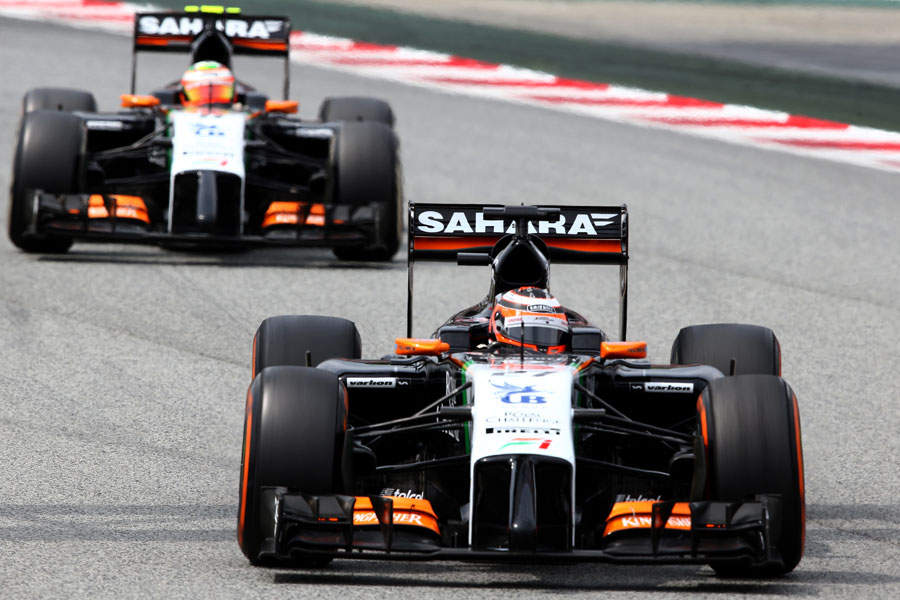 Nico Hulkenberg approaches a corner with team-mate Sergio Perez in his mirrors