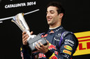 Daniel Ricciardo admires the trophy after securing his maiden podium