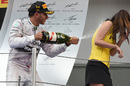 What would Nicole say? Lewis Hamilton celebrates victory by soaking a grid girl