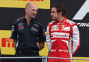 Adrian Newey talks to Fernando Alonso on the podium