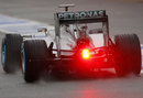 Lewis Hamilton leaves the pits in the Mercedes