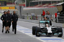 Lewis Hamilton stops in the pit lane