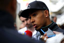 Lewis Hamilton talks to the media after a day of testing