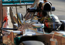 Nico Rosberg returns to the pits with Mercedes' new 'megaphone' exhaust attached to his car