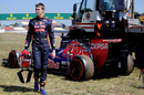 Daniil Kvyat walks away from his stricken Toro Rosso