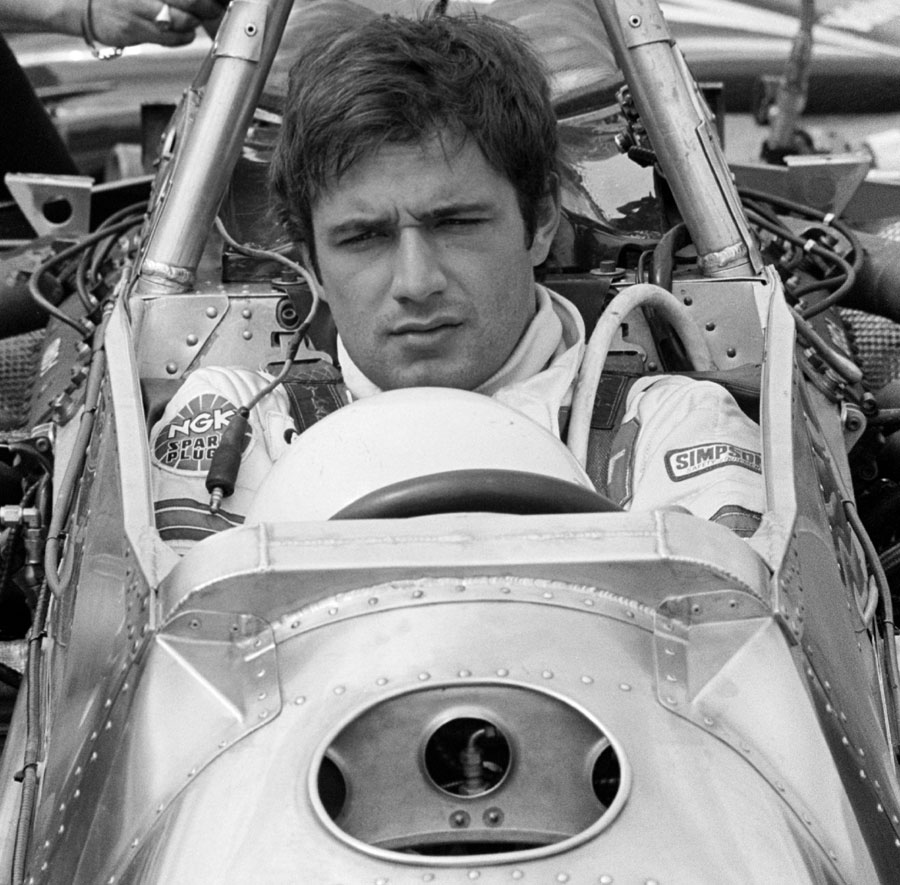 Elio de Angelis sits in the cockpit ahead of the race