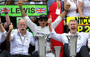Lewis Hamilton celebrates with Mercedes in the paddock