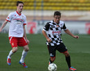 Fernando Alonso moves forward with the ball at the annual charity football match in Monaco