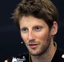 Romain Grosjean answers a question in front of the press