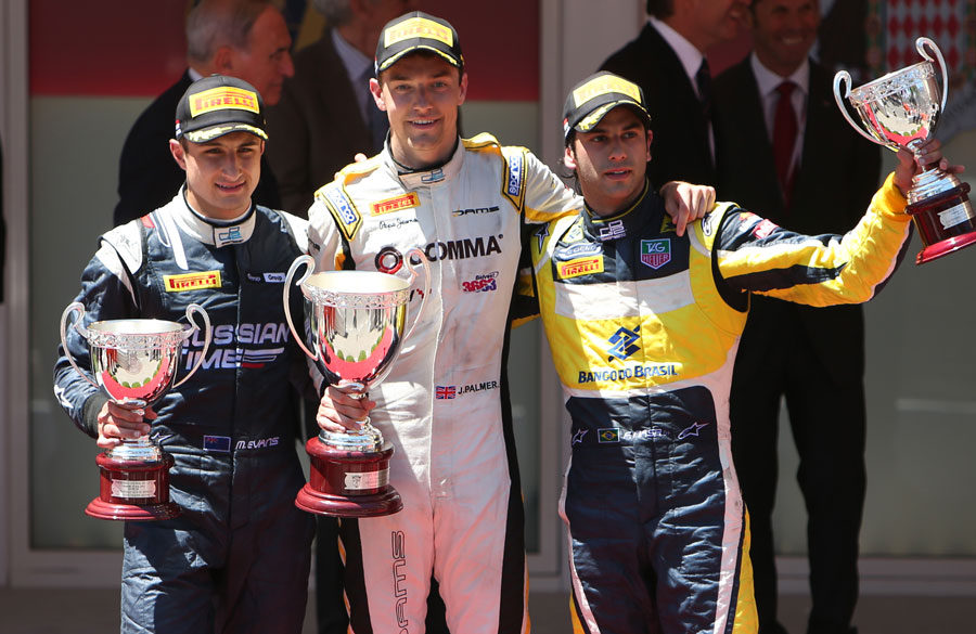 Jolyon Palmer celebrates victory in the Monaco feature race flanked by Mitch Evans and Felipe Nasr
