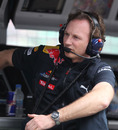Christian Horner watches practice from the pit wall