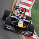 Mark Webber rides the kerb on his way to the fastest lap