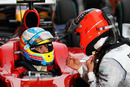 Michael Schumacher shares his thoughts with Fernando Alonso