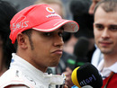 Lewis Hamilton talks to the press after a disappointing qualifying