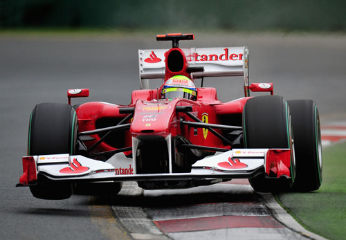 Felipe Massa's Ferrari hops over the kerbs