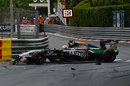Sergio Perez ends up in the wall on the first lap after contact with Jenson Button