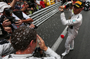Lewis Hamilton gives Nico Rosberg a soaking