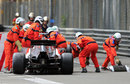 Marshals get to work on removing Esteban Gutierrez's beached car and debris at Rascasse