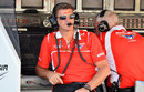 Marussia's Graeme Lowdon looks on from the pit wall