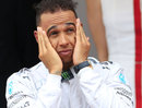 Lewis Hamilton cuts a disappointed figure on the podium