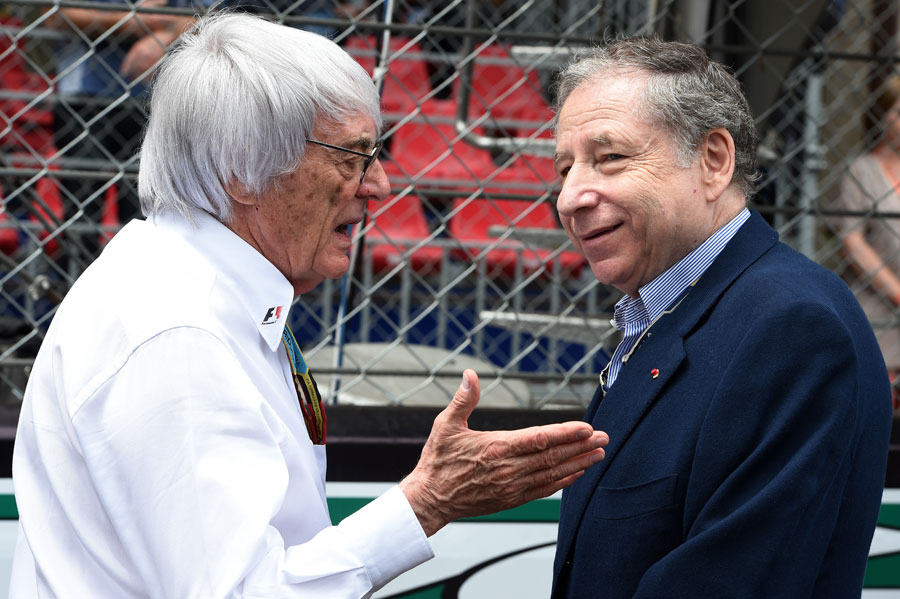 F1 chief Bernie Ecclestone and FIA president Jean Todt talk on the grid