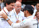 Lewis Hamilton celebrates with Mercedes boss Toto Wolff