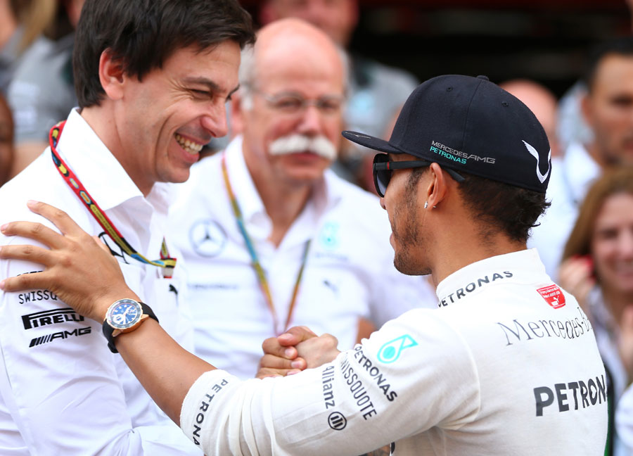 Lewis Hamilton celebrates with Mercedes boss Toto Wolff