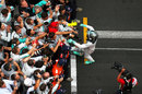 Nico Rosberg celebrates with his Mercedes team