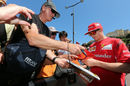 Kimi Raikkonen signs autographs for fans