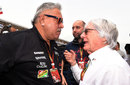 Vijay Mallya talks to Bernie Ecclestone on the grid prior to the race
