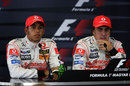 Lewis Hamilton and Fernando Alonso look on after a controversial qualifying session