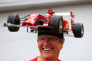 Ferrari fan Kim Reiner shows off his new F14 T hat 