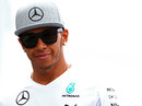 Lewis Hamilton walks through the paddock