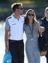 Jenson Button arrives at the paddock with Jessica Michibata on Saturday